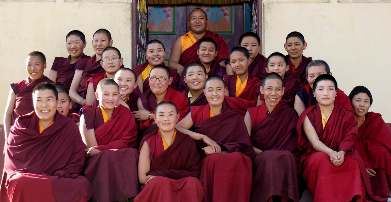 women in buddhism with teacher smiling sangha nunnery