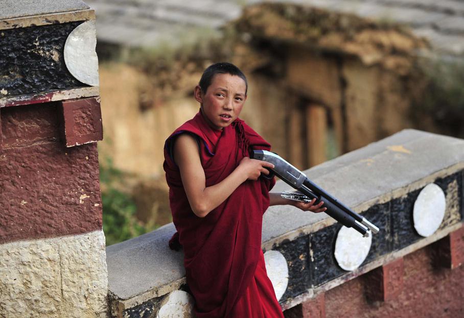 buddhist boy gun violent buddhism theravada Myanmar