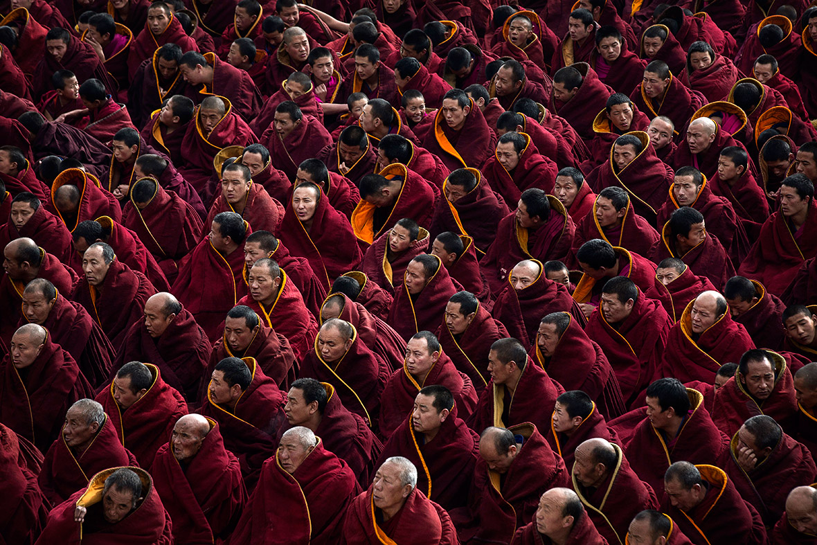 a lot of monks tibet Nepal Bhutan meditation red robes